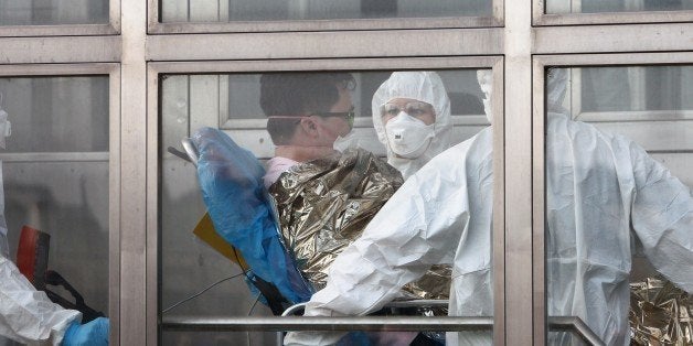 A South Korean patience suspected of suffering from Middle East Respiratory Syndrome (MERS) is admitted to Kramare hospital in Bratislava, Slovakia after the he was transported by medical staff from the Northern Slovak town of Zilina on June 13, 2015. AFP PHOTO / STRINGER (Photo credit should read STRINGER/AFP/Getty Images)