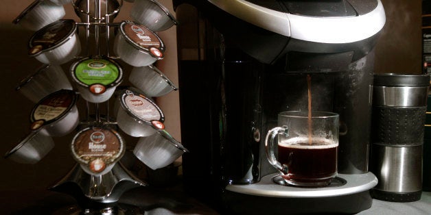 Keurig's Vue individual coffee roasting system is displayed during a Green Mountain Coffee Roasters news conference in New York, Wednesday, Feb. 15, 2012. The coffee machine can also prepare frothy hot beverages as well as iced drinks. (AP Photo/Kathy Willens)