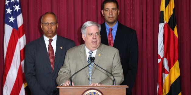 BALTIMORE, MD - MAY 06: Maryland Governor Larry Hogan (C) is flanked by Lt. Gov. Boyd Rutherford (L) and state delegete Keiffer Mitchell (R) during a news conference on May 6, 2015 in Baltimore, Maryland. Hogan announced he had ended a state of emergency in Baltimore imposed after the riots and looting that followed the funeral of Freddie Gray. Gray, 25, was arrested for possessing a switch blade knife on April 12. According to his attorney, he died a week later in the hospital from a severe spinal cord injury he received while in police custody. (Photo by Rob Carr/Getty Images)