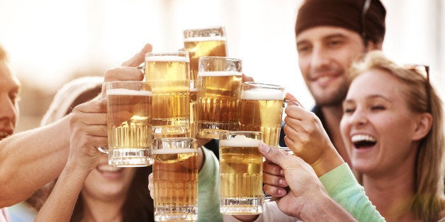 Young people at bistro having beer. iStockalypse California, Venice Beach