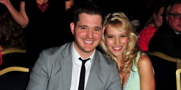 FILE - In this June 29, 2012 file photo, singer Michael Buble and his wife, Argentine TV actress Luisana Lopilato, pose at the Nordoff Robbins 02 Silver Clef Awards at London Hilton, in London. His new album, ᅢ까タᅡワTo Be Loved,ᅢ까タᅡン will be released April 23 and includes a tribute to his wife. They announced in January their expecting their first child. (Photo by Jon Furniss/Invision/AP, File)