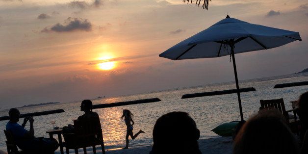 Foreign tourists gather at a sand-bar to watch sunset at Kurumba resort in Male atoll, Maldives, Thursday, Feb. 16, 2012.The Indian Ocean island nation that is economically reliant on high-end tourism has been in political turmoil since then-President Mohamed Nasheed ordered a top judge arrested earlier this year and began losing support from the security forces.Tourism is the main industry in the Maldives, blessed with sandy beaches and coral. Most beach resorts have been untouched by the protests in Male and the southernmost atoll, Addu.(AP Photo/ Gemunu Amarasinghe)