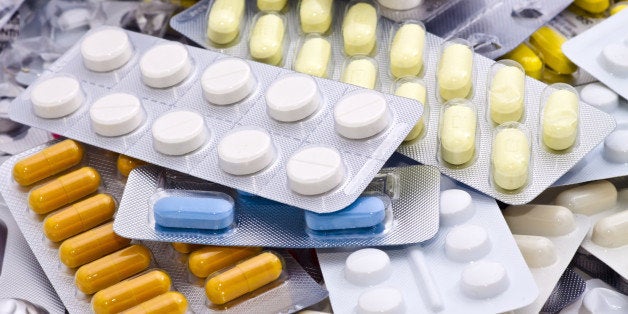 Close up of packs of pills and capsules.