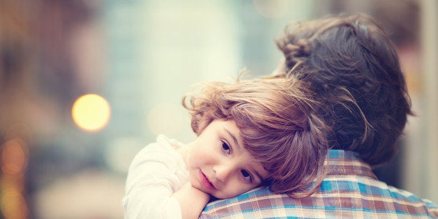 little girl resting on her...