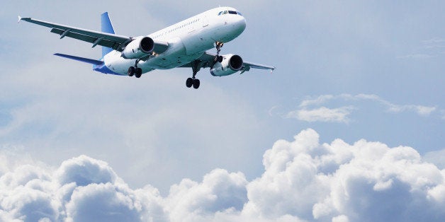 airplane flying over cloudy sky....