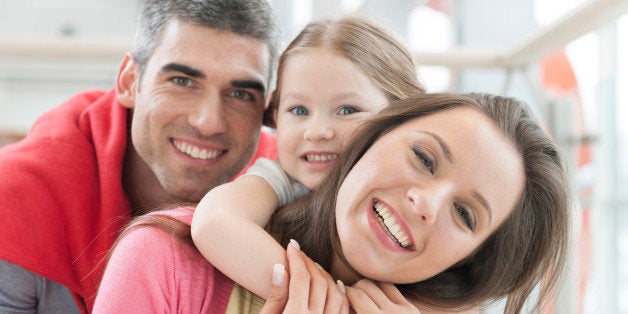 Young happy family in shopping mall