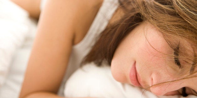 Young woman in bed, portrait