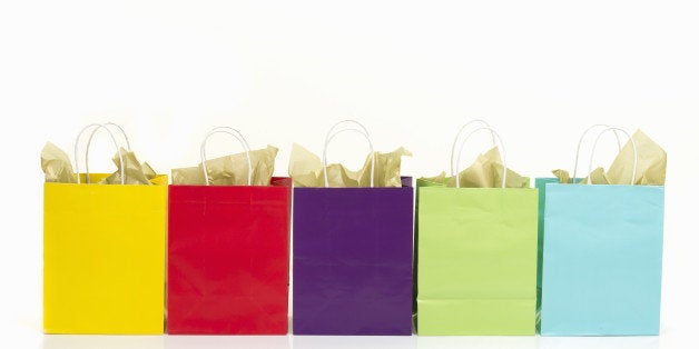 Colored shopping bags on white