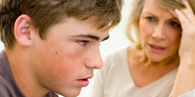 Teenager listening to mother speak