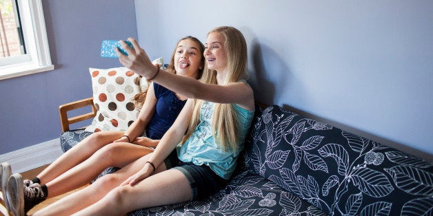 Two sisters taking a selfie