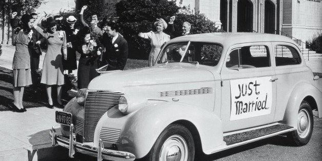 BRIDE AND GROOM AND WELL WISHERS BY AUTO