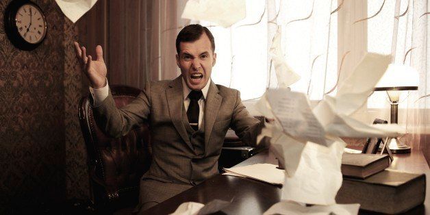 Angry businessman throwing a documents