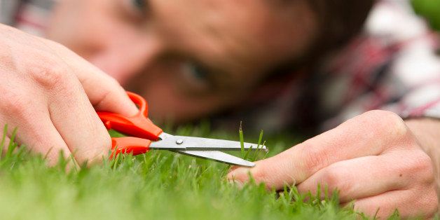 Man with shear on grass, ocd