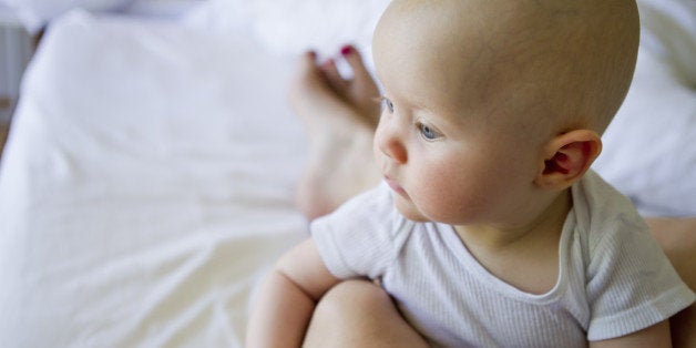 Baby girl on mother's lap