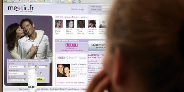 Paris, FRANCE: A picture taken 04 October 2005 shows a woman looking at a computer screen in Paris displaying a page of the internet site 'Meetic.fr'. Europe's biggest online dating agency, Meetic, made a confident debut on the Paris stock exchange 13 October 2005 as investors embraced the Internet company dedicated to companionless love-seekers. Shares in Meetic, which is active in 13 countries and boasts 14 million users, showed a 9.87-percent gain at 1030 GMT to 24.50 euros. The CAC 40 index of leading shares was 0.90 percent lower. AFP PHOTO GABRIEL BOUYS (Photo credit should read GABRIEL BOUYS/AFP/Getty Images)