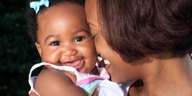 happy baby smiling at the camera