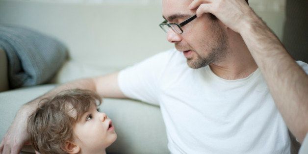 Father talking to young son, portrait