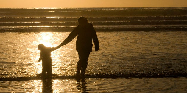 Mother and Child walking in the sea