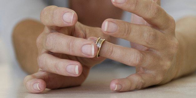 Close up of woman putting on ring