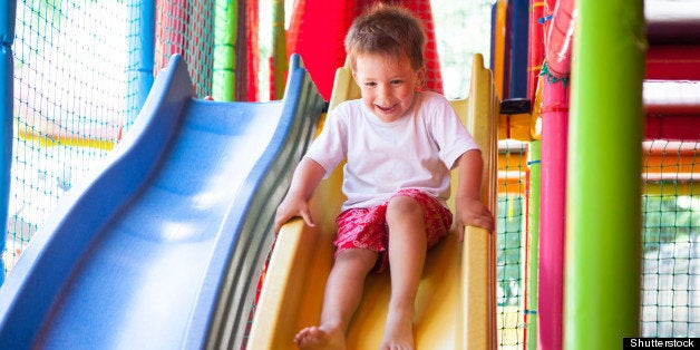 happy boy on slide