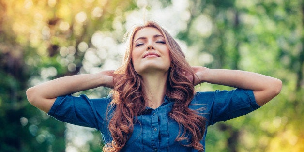 Free Happy Woman Enjoying Nature. Beauty Girl Outdoor. Freedom concept. Beauty Girl over Sky and Sun. Sunbeams. Enjoyment.