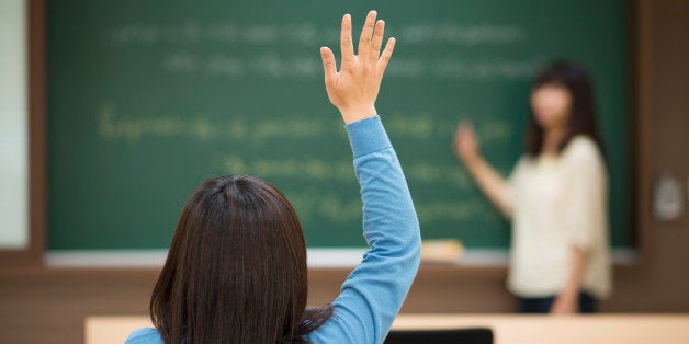 There is a teacher stand in front of the classroom