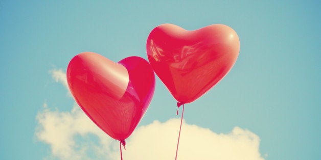 Two red heart-shaped balloons