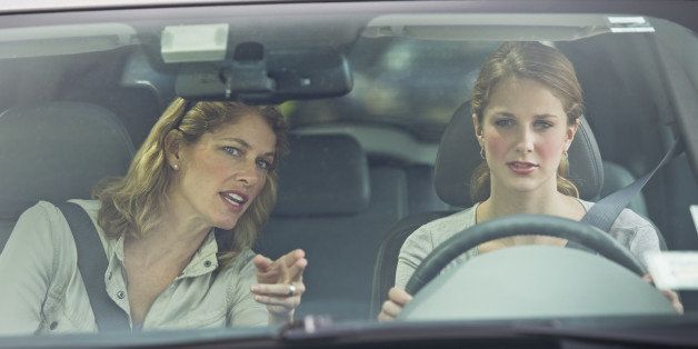 Mother teaching her daughter how to drive