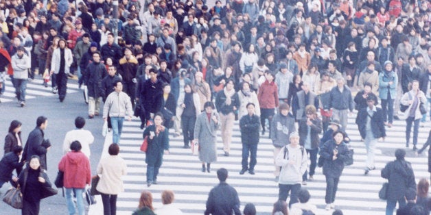 Large crowd of people crossing city street, Shibuya, Tokyo, Japan