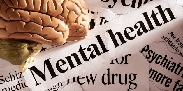 Close up of model brain on mental health headlines