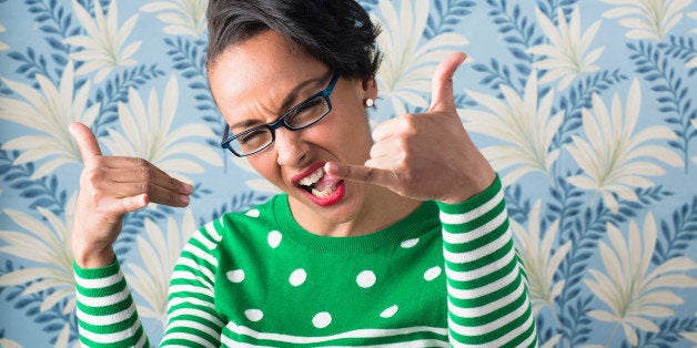 Retro style portrait of woman with thumbs up