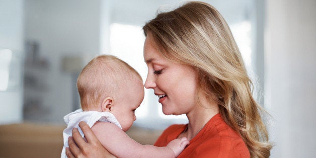 Shot of a young mother holding her baby at homehttp://195.154.178.81/DATA/i_collage/pu/shoots/804608.jpg