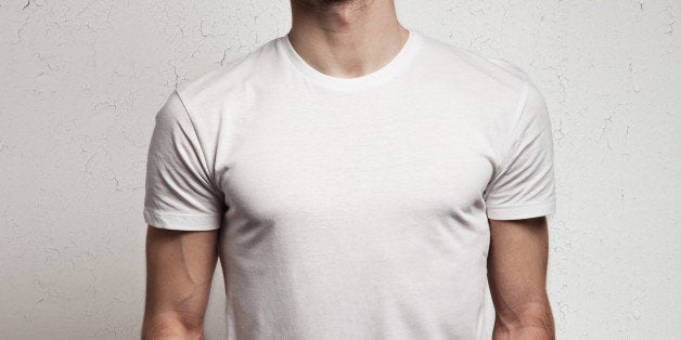 blank white t-shirt on muscle young man and white wall background