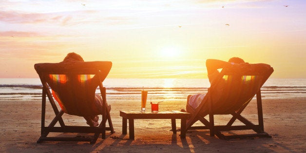 happy couple enjoy luxury sunset on the beach during summer vacations