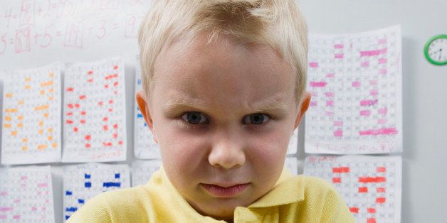 Angry Little Boy in a Classroom
