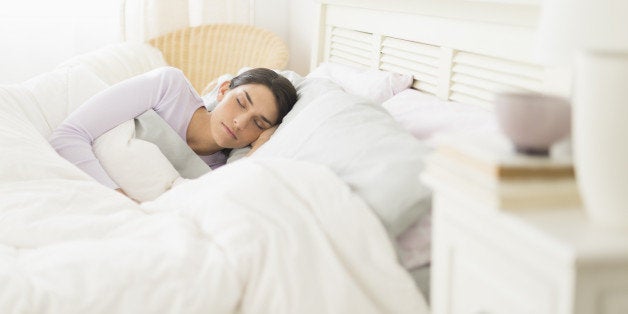 USA, New Jersey, Jersey City, Woman sleeping in bed