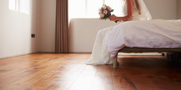 Bride In Bedroom Having Second Thoughts Before Wedding