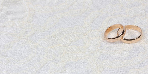 weddings golden rings on white...