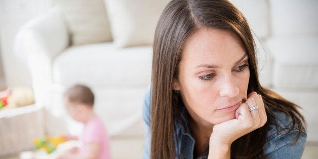 Mother with daughter (6-11 months) in living room