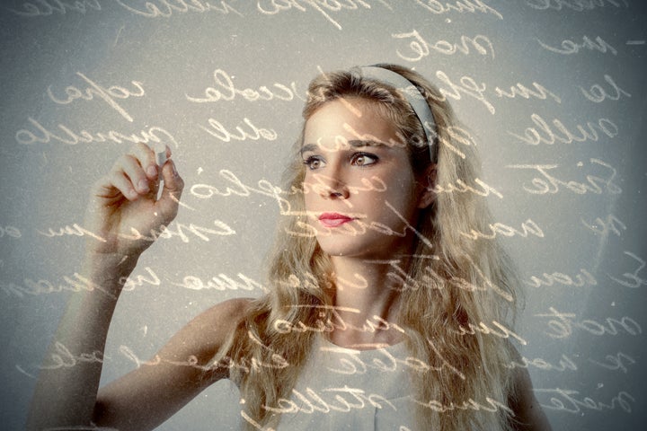 Beautiful girl writing a letter