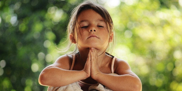 girl on meditation in the morning park
