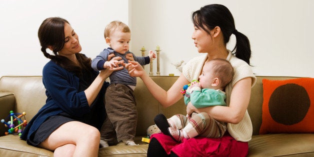 Mothers and their babies playing