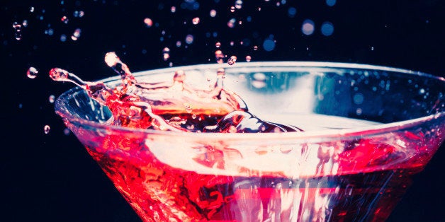 red splashing cocktail on black