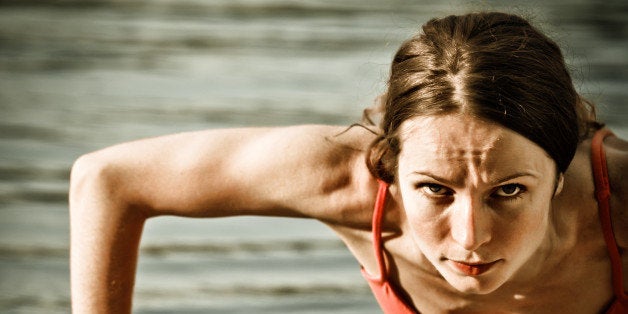 strong woman doing push up at...