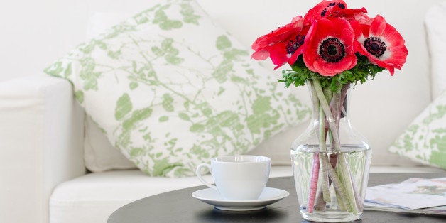 vase of red flowers in modern white living room - home decor