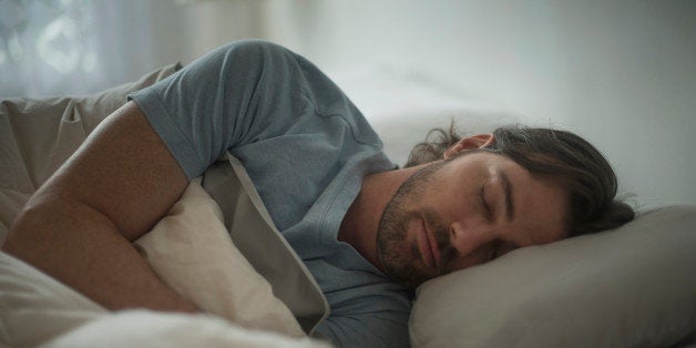 USA, New Jersey, Man sleeping in bed