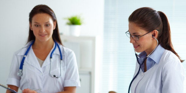 portrait of two female doctors...