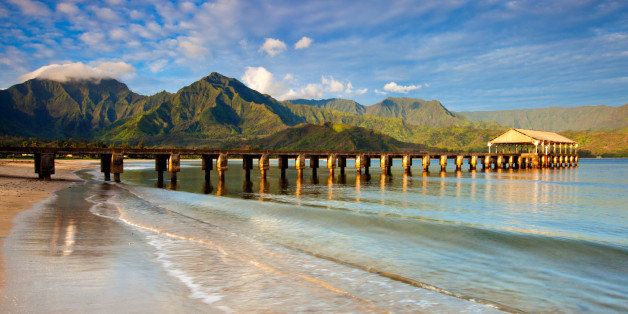 Seascape of Hanalei bay pier beach on North Shore of Kauai, Hawaii, USA.