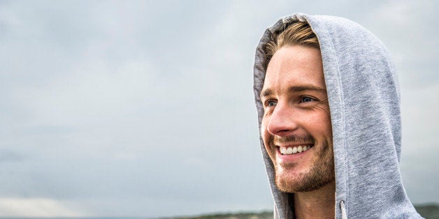 Caucasian man smiling on beach