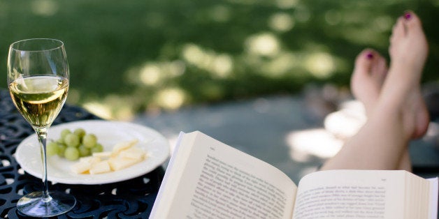 Peaceful time outside with good book, glass of wine, and plate of fruit and cheese.